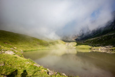 A cloud over a high-altitude lake