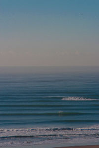 Scenic view of sea against clear sky during sunset