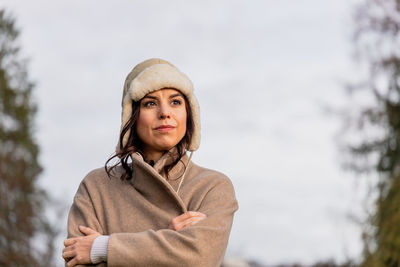 Portrait of young woman looking at camera