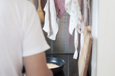 Midsection of woman standing at home