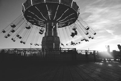 Low angle view of ferris wheel against sky