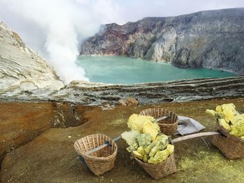 Scenic view of waterfall against sky
