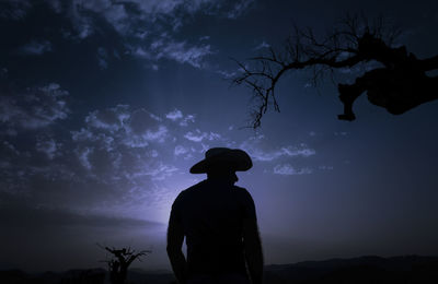 Silhouette of adult man standing on desert at night. almeria, spain