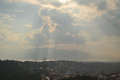 High angle view of buildings in city against sky