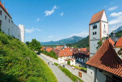 Buildings in town against sky