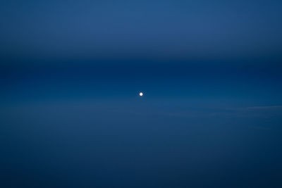 Scenic view of moon against blue sky at night