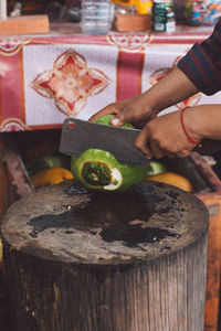 Close-up of man preparing food on table