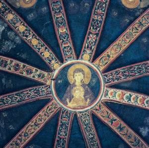 Low angle view of ornate ceiling in temple
