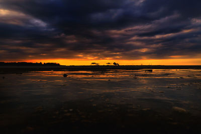 Scenic view of sunset over calm sea