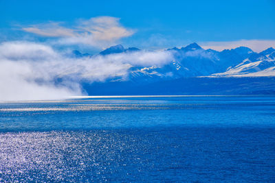 Scenic view of sea against blue sky