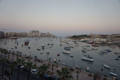 High angle view of boats in sea at sunset