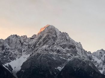 Scenic view of snowcapped mountains against clear sky