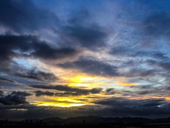 Scenic view of dramatic sky during sunset