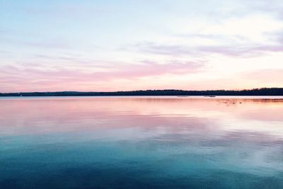 Scenic view of lake at sunset