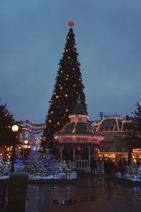 Illuminated christmas lights in city at night