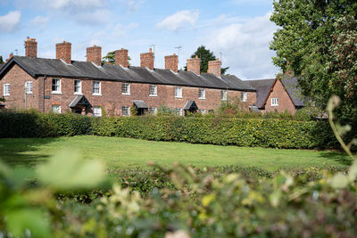 House on field against sky