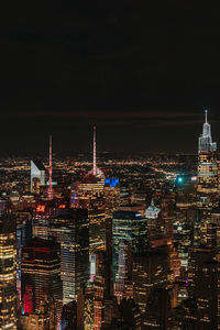 Illuminated buildings in city at night