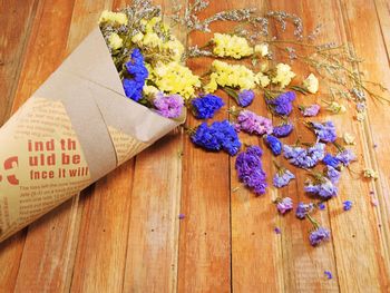 High angle view of purple flowering plant on wooden table