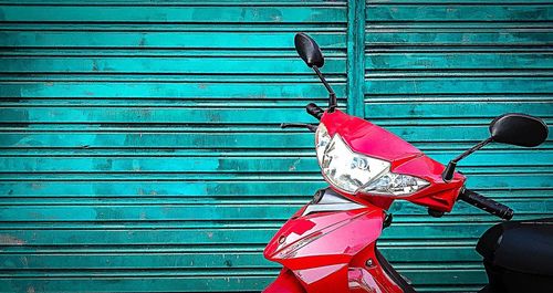 Red umbrella against blue wall