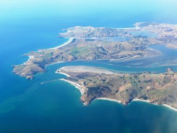 Aerial view of landscape and sea against sky