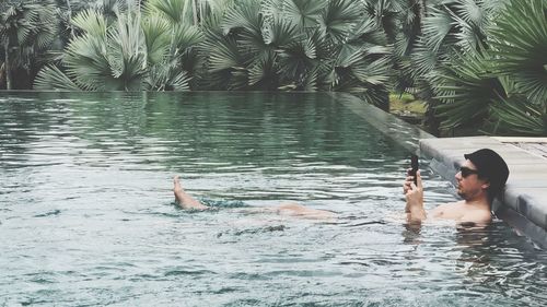 Man swimming in pool