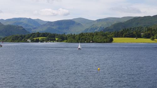 Scenic view of sea against mountains