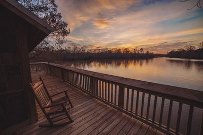 Scenic view of lake against sky during sunset