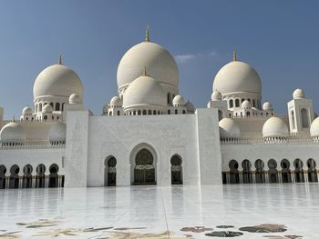 Low angle view of mosque against clear sky