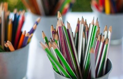 Close-up of multi colored pencils on table