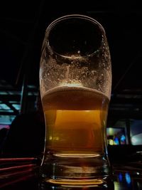 Close-up of beer glass on table