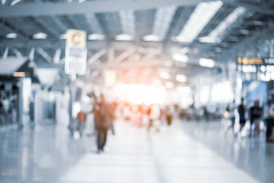Blurred motion of people walking at airport