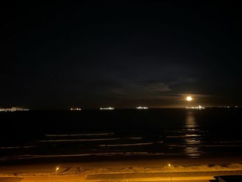 Scenic view of sea against sky at night