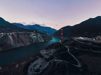 Scenic view of river against sky during sunset