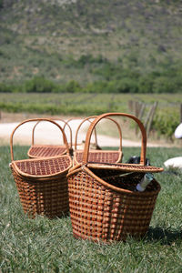 Close-up of wicker basket on field