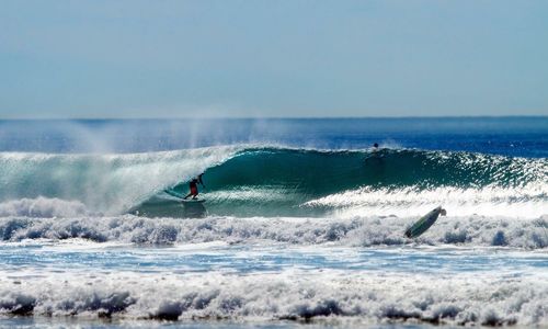 People surfing in sea