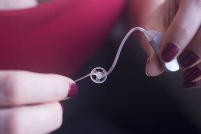 Close-up of hand holding ring