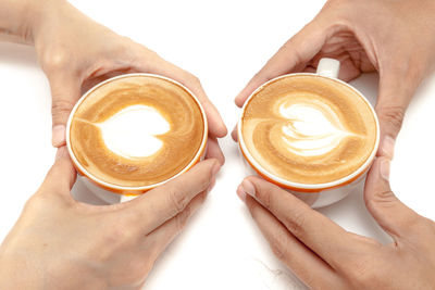 Midsection of woman holding coffee cup