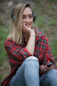 Young woman listening to music