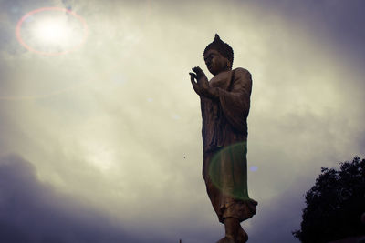 Low angle view of statue against sky