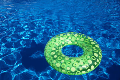 High angle view of inflatable ring on swimming pool