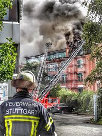 Rear view of a man standing in building