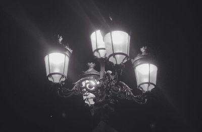 Low angle view of lit lamp