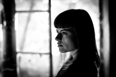 Portrait of young woman looking away