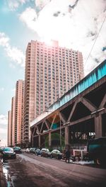 Bridge in city against sky