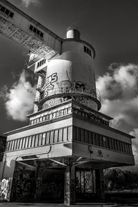 Low angle view of building against cloudy sky
