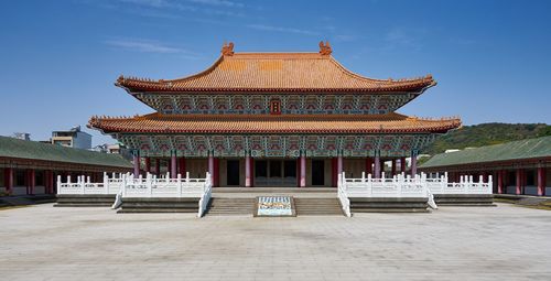 Temple outside building against sky