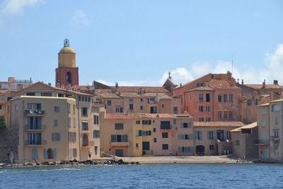 Buildings in distance with waterfront