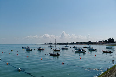 High angle view of boats moored in sea against sky