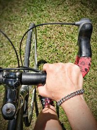 Low section of person with bicycle on road