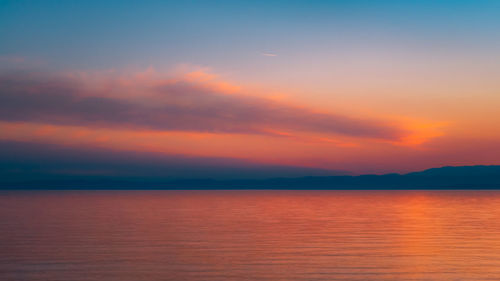 Scenic view of sea against sky at sunset